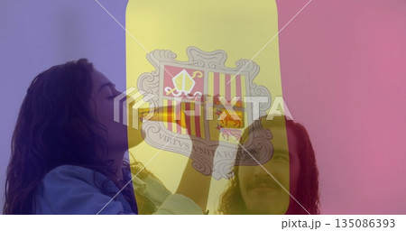 Denim-clad woman sipping bottle and T-shirt-clad man standing in montage, with flag crest overlay 135086393