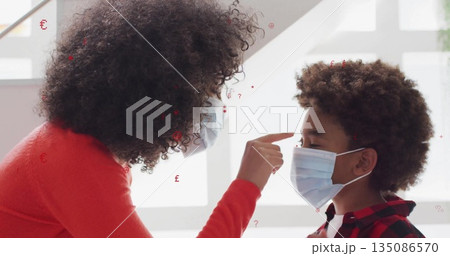 Leaning masked woman in red sweater pointing at boy's forehead at grid windows, with surgical masks Leaning masked woman in red sweater pointing at boy's forehead at grid windows, with surgical masks 135086570