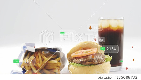 Showcasing burger with lettuce and tomato on studio tabletop, featuring fries, cola and UI icons Showcasing burger with lettuce and tomato on studio tabletop, featuring fries, cola and UI icons 135086732