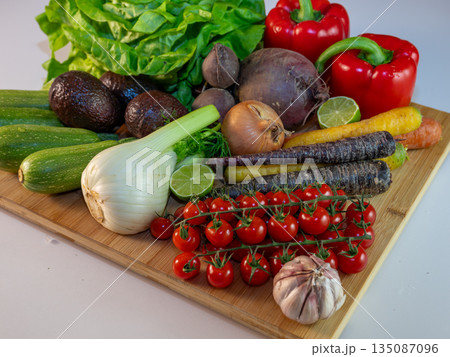 Assortment of fresh organic vegetables in baskets at a farmers market or supermarket. Healthy natural products for diet, clean eating, and sustainable lifestyle. 135087096