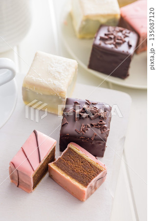 Sweet dessert cake. Mini pie on white table. 135087120