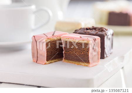 Sweet dessert cake. Mini pie on white table. Sweet dessert cake. Mini pie on white table. 135087121