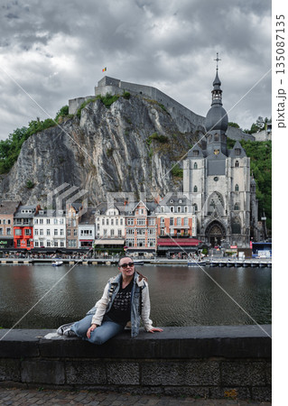 Scenic view of Dinant, Belgium, featuring historic riverside buildings and the citadel perched above the Meuse River. 135087135