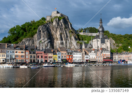 Scenic view of Dinant, Belgium, featuring historic riverside buildings and the citadel perched above the Meuse River. 135087149