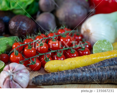 Assortment of fresh organic vegetables in baskets at a farmers market or supermarket. Healthy natural products for diet, clean eating, and sustainable lifestyle. Assortment of fresh organic vegetables in baskets at a farmers market or supermarket. Healthy natural products for diet, clean eating, and sustainable lifestyle. 135087231