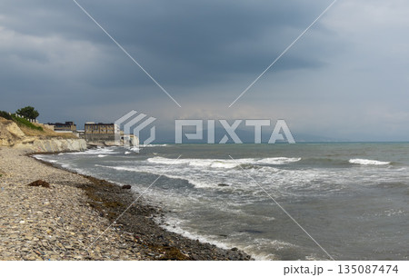 Myskhako beach in Russia with the sea and resort area, showing coastal recreation, tourism infrastructure and summer seaside life 135087474