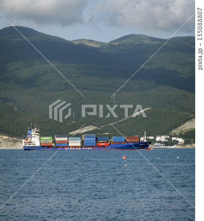 August 24, 2025: Large cargo ship entering the port of Novorossiysk, Russia, on the Black Sea, illustrating maritime transport, industrial shipping and coastal infrastructure 135088807