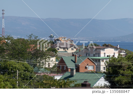 August 12 2025 Top view from Mount Koldun overlooking the sea and coastline toward the resort village of Myskhako near Novorossiysk Russia on the Black Sea coast. Coastal landscape and shoreline 135088847