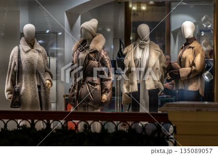 Winter Fashion Display Of Cozy Coats And Accessories In A Boutique Window 135089057