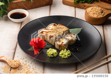 Fried sushi rolls with sauce and sesame Fried sushi rolls with sauce and sesame 135089150