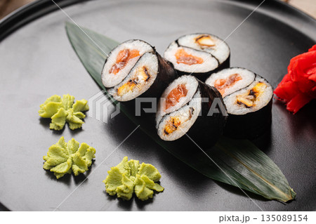 Yin yang sushi rolls with eel and salmon 135089154