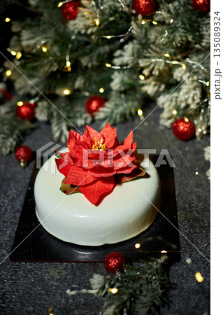 Festively Decorated Dessert Featuring a Vibrant Flower Centerpiece Perfect for Holiday Celebrations and Events 135089324