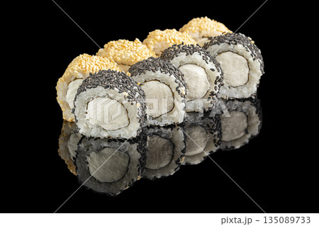 Elegant sushi rolls filled with creamy cheese are coated in contrasting black and white sesame seeds, arranged on a glossy reflective black surface Elegant sushi rolls filled with creamy cheese are coated in contrasting black and white sesame seeds, arranged on a glossy reflective black surface 135089733