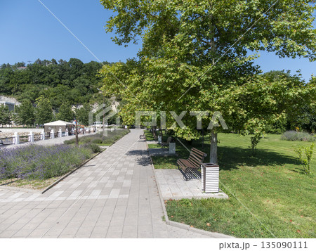 August 19, 2025 The promenade along Lake Abrau-Dyurso with calm water, greenery, and scenic surroundings 135090111