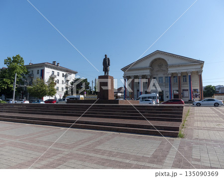 August 12, 2025: Novorossiysk City Palace of Culture and the Lenin monument in the city center of Novorossiysk, Russia 135090369