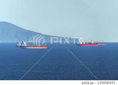 August 22 2025 Oil tankers waiting for loading in Tsemesskaya Bay near Novorossiysk Russia on the Black Sea. Large vessels anchored offshore August 22 2025 Oil tankers waiting for loading in Tsemesskaya Bay near Novorossiysk Russia on the Black Sea. Large vessels anchored offshore 135090435