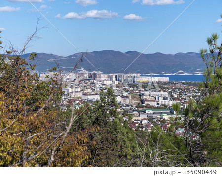 August 12 2025 Top view from Mount Koldun overlooking the sea and coastline toward the resort village of Myskhako near Novorossiysk Russia on the Black Sea coast. Coastal landscape and shoreline 135090439