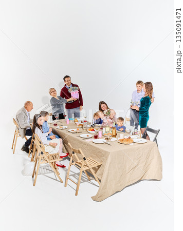 Warm family celebration of Mother Day with flowers and joyful moments 135091471