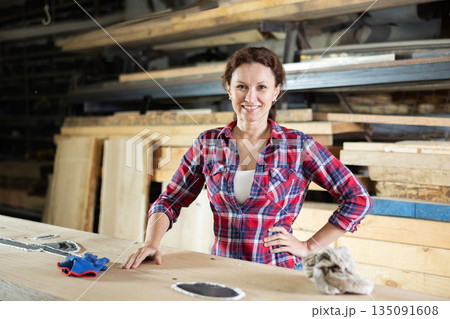 Adult woman posing with oak plank Adult woman posing with oak plank 135091608