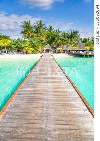 Tranquil relaxing wooden pier pathway into tropical island paradise sunny beach landscape turquoise ocean calm water palm trees sunny sky Maldives luxury summer vacation travel tourism background Tranquil relaxing wooden pier pathway into tropical island paradise sunny beach landscape turquoise ocean calm water palm trees sunny sky Maldives luxury summer vacation travel tourism background 135092094