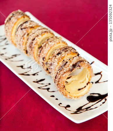 Hungarian sweet bun on a red background Hungarian sweet bun on a red background 135092324