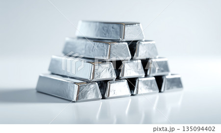 Silver bullion bars stacked in pyramid shape 135094402