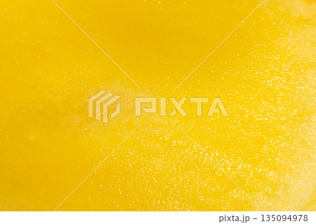 Abstract background of juicy yellow mango fruit flesh. 135094978