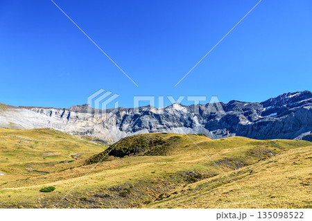 Hiking trail in Cirque de Troumouse at Heas in the Hautes-Pyrenees department in France, forming the border with Spain 135098522