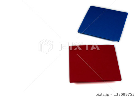 Korean paper flip cards. Isolated on white background. Traditional Korean game with two piece of paper. Red and blue paper squares. Idea for simple game with origami technique Korean paper flip cards. Isolated on white background. Traditional Korean game with two piece of paper. Red and blue paper squares. Idea for simple game with origami technique 135099753