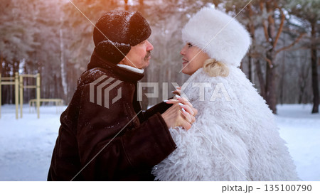 Warm Winter Companionship, Retired Individuals Forge Bonds Amidst Winter Pine Scenery, Older Professionals Find Comfort And Camaraderie During Snowy Days Surrounded By Lush Pine Forests Warm Winter Companionship, Retired Individuals Forge Bonds Amidst Winter Pine Scenery, Older Professionals Find Comfort And Camaraderie During Snowy Days Surrounded By Lush Pine Forests 135100790
