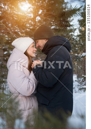 Warmhearted Scene In Snowy Woods, Emotional Moment Captured With Warm Light And Winter Clothing, Couple Shares Deep Connection Amidst Winter Landscape With Tender Expressions And Rings Warmhearted Scene In Snowy Woods, Emotional Moment Captured With Warm Light And Winter Clothing, Couple Shares Deep Connection Amidst Winter Landscape With Tender Expressions And Rings 135100814