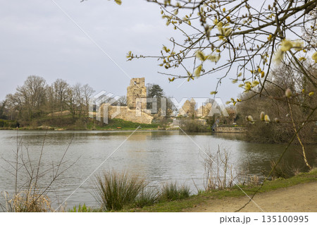 Saint Aubin du Cormier castle ruins reflecting on lake water 135100995