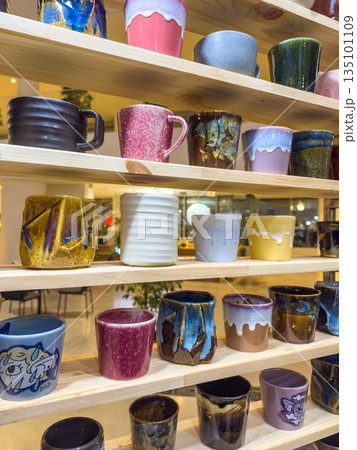 Handmade ceramic beverage containers exhibited in welcoming retail space Handmade ceramic beverage containers exhibited in welcoming retail space 135101109