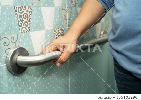 Asian elderly woman patient use toilet bathroom handle security in nursing hospital, healthy strong medical. Asian elderly woman patient use toilet bathroom handle security in nursing hospital, healthy strong medical. 135101290