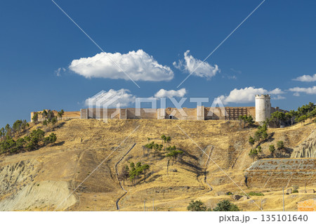 Lucera castle wall and tower on dry hill 135101640