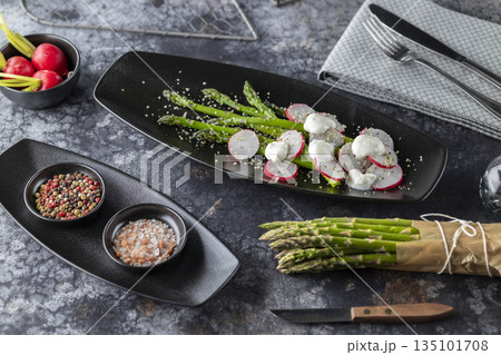 Asparagus salad with radishes and mozzarella balls Asparagus salad with radishes and mozzarella balls 135101708