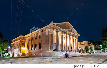 Galloway Memorial United Methodist Church is located in Jackson, Mississippi, USA. Historic Neoclassical architecture features the illuminated portico and massive stone columns under a dark night sky 135102117