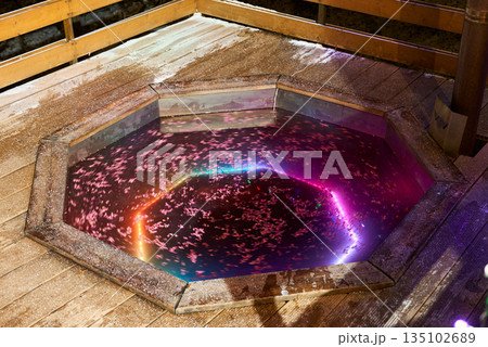 Serene spa surrounded by glowing petals and calming light 135102689