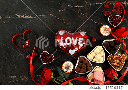 Food for Valentine's Day or Women's Day, Gourmet heart shaped chocolate candies, sugar cranberry, meringue and rose flowers, greeting card, advertising banner or store invitation. 135103174
