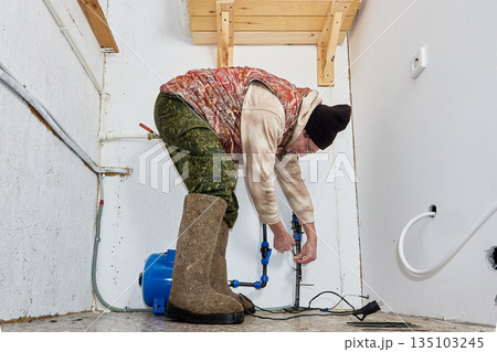 After shutting off water until spring homeowner installs heating cable on incoming pipe below valve so winter frost does not rupture pipe. 135103245