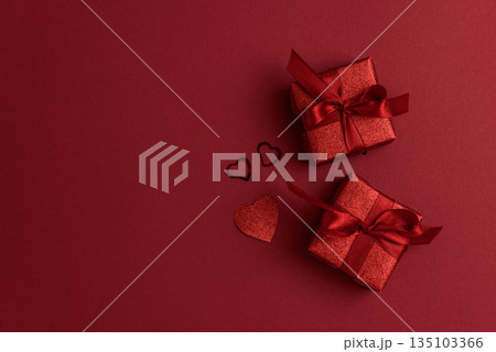 Red Glitter Gift Boxes and Hearts on Festive Background for Valentine's Day Celebration Red Glitter Gift Boxes and Hearts on Festive Background for Valentine's Day Celebration 135103366