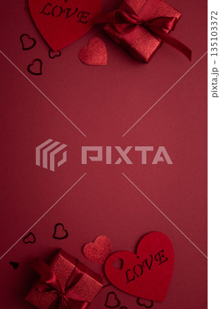 Festive Red Gift Boxes with Heart Confetti onFestive Background for Valentine's Day Celebration 135103372