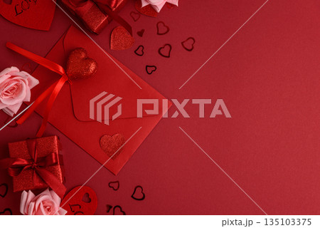 Romantic Envelope with Gifts and Roses on Festive Red Background for Valentine's Day Celebration Romantic Envelope with Gifts and Roses on Festive Red Background for Valentine's Day Celebration 135103375