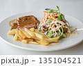 Close up of Grilled pork steak, boiled french fries and vegetable salad;Selective focus 135104521