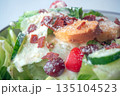 Close up of Caesar Salad: Crisp romaine lettuce tossed with Parmesan, croutons, and a creamy Caesar dressing, 135104523