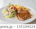 Close up of Grilled pork steak, boiled french fries and vegetable salad;Selective focus 135104524