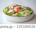 Caesar Salad: Crisp romaine lettuce tossed with Parmesan, croutons, and a creamy Caesar dressing, 135104526