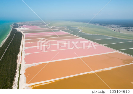 Colorful salt evaporation ponds creating a vibrant landscape in Mexico Colorful salt evaporation ponds creating a vibrant landscape in Mexico 135104610