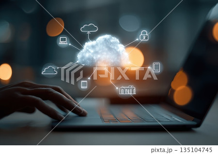 Hands work over a laptop during a data analysis session in a modern office focused on cloud computing 135104745