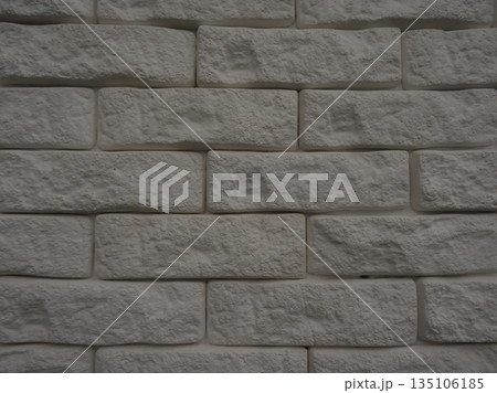 Brick Wall Of The Artificial Plaster Bricks Texture Background Brick Wall Of The Artificial Plaster Bricks Texture Background 135106185